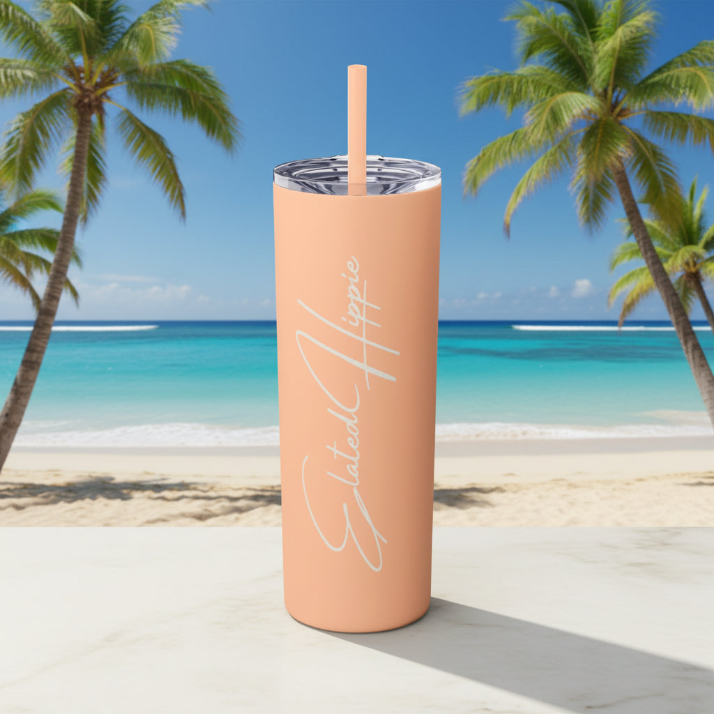 Peach-colored tumbler with a straw on a white background