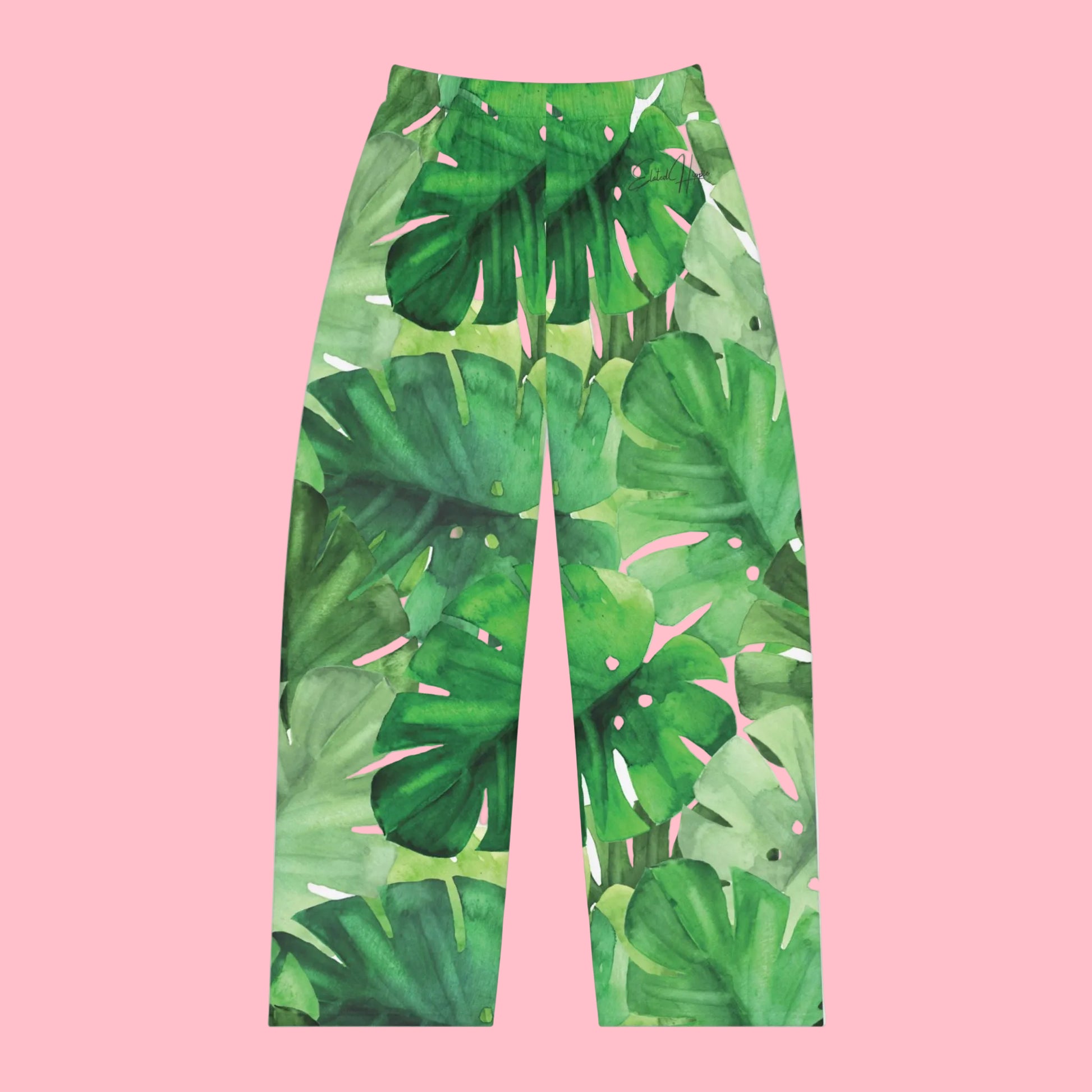 Green leaf-patterned pants on a white background
